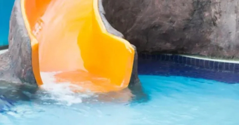 image Yellow Waterslide into Baptismal Pool inside a Church
